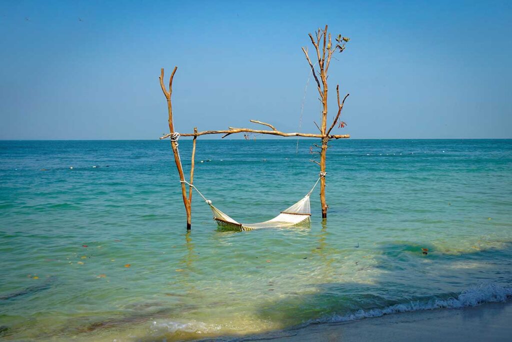 Hammock in shallow turquoise water at Starfish Beach Rach Vem Phu Quoc