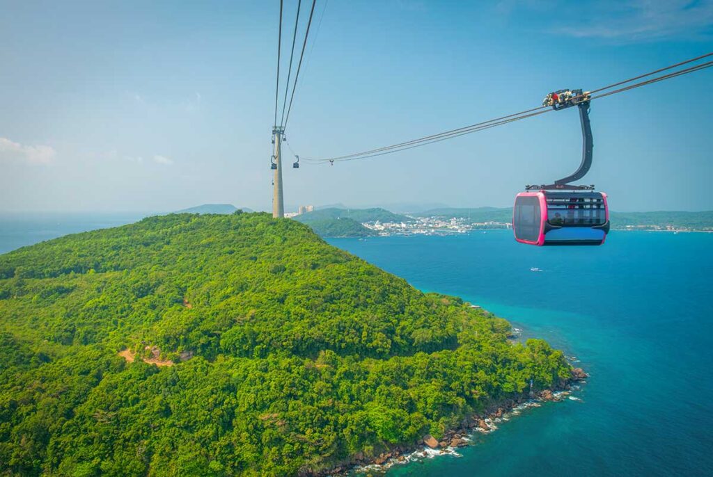 Phu Quoc Cable Car cabin above green island coastline and ocean views