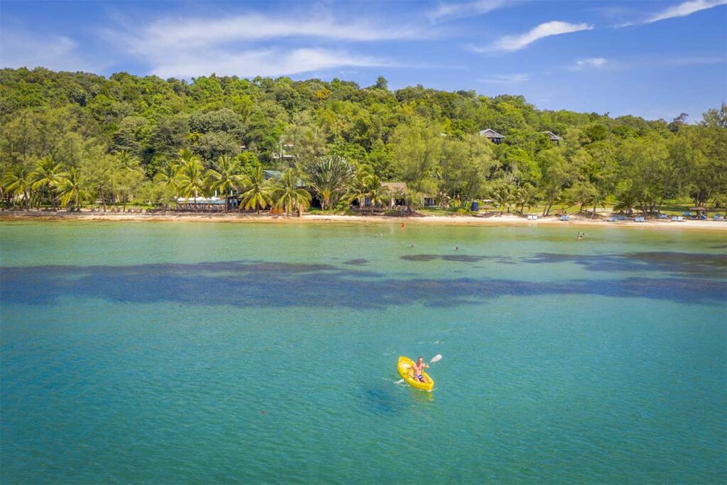 Aerial view of kayaking at Ong Lang Beach Phu Quoc with clear water and green tropical coast