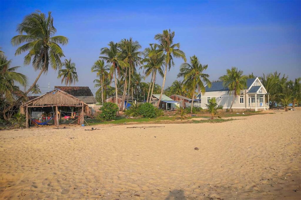 Cua Can Beach Phu Quoc local village houses with palm trees beside the sandy beach