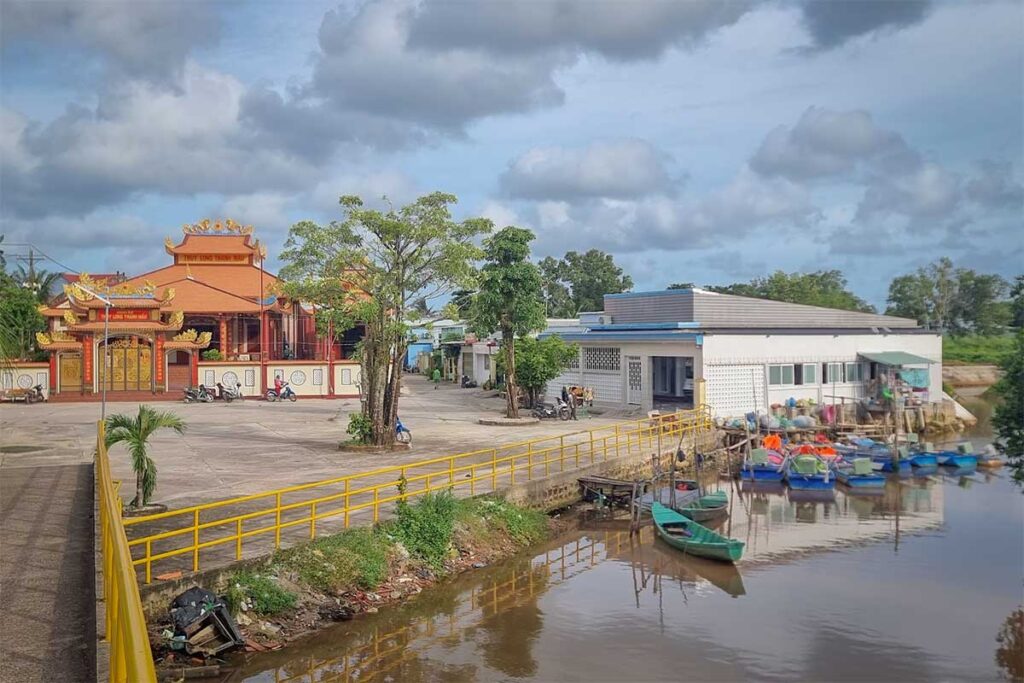 Temple and fishing boats beside the water in Ham Ninh fishing village Phu Quoc on the east coast