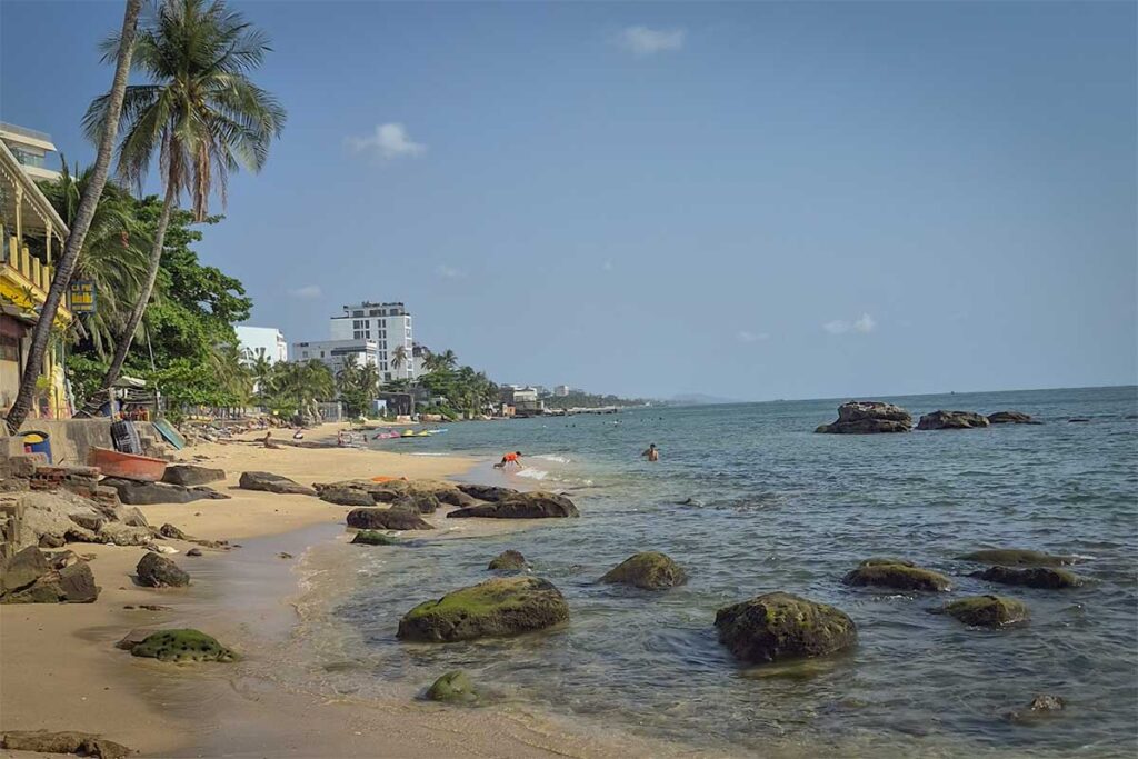 Long Beach Bai Truong northern area near Duong Dong town with rocky shoreline small beach and seaside buildings