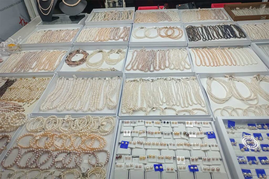 pearl jewelry stall at Phu Quoc Night Market with necklaces bracelets and earrings on display