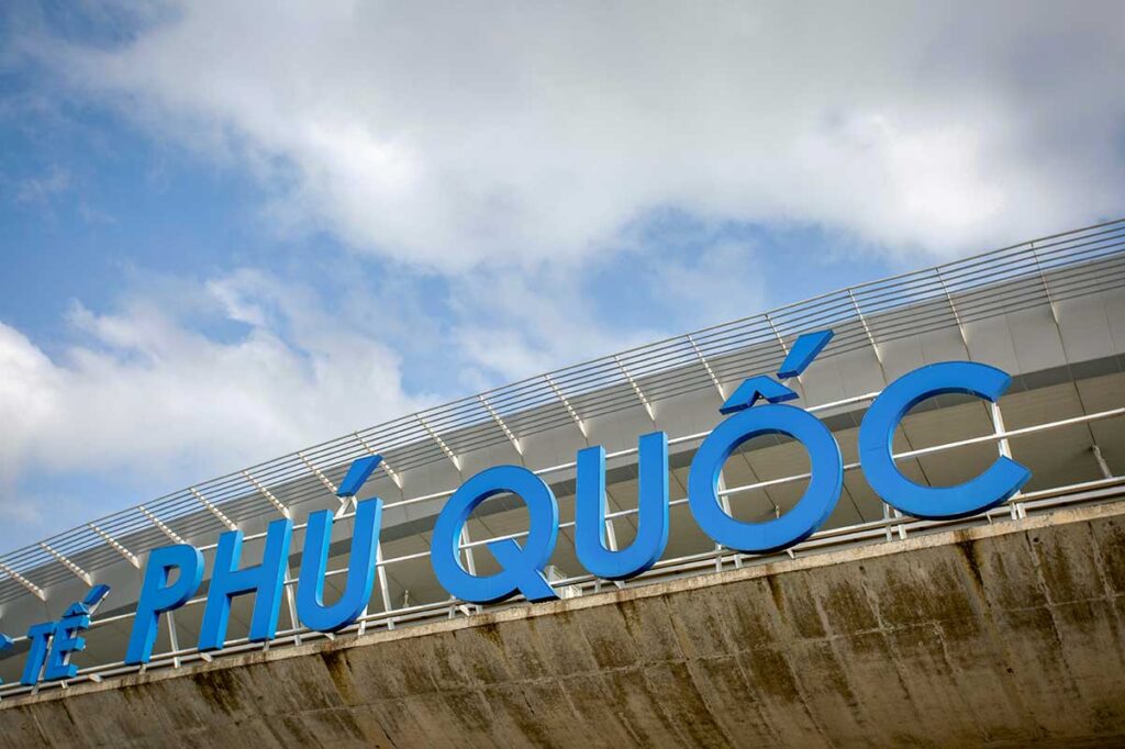 Phu Quoc Airport terminal sign on exterior building under blue sky
