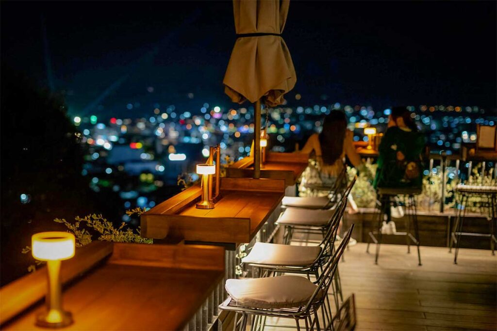 Rooftop bar near Duong Dong Phu Quoc with night city views and stylish seating for nightlife drinks