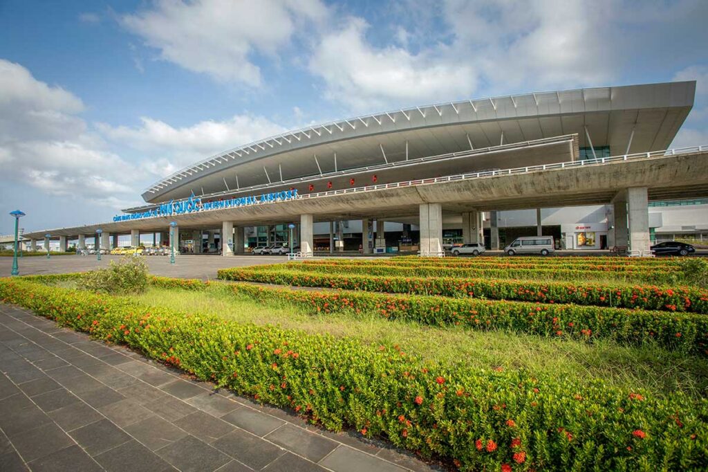 Front view of Phu Quoc International Airport terminal building with landscaped gardens outside
