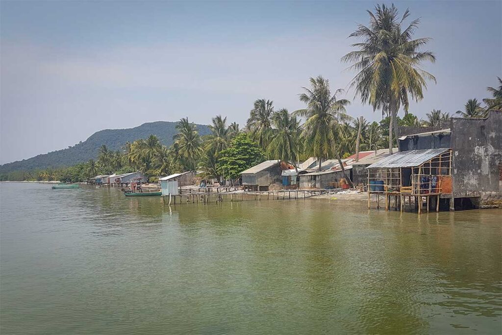 Rach Tram Phu Quoc fishing village waterfront with stilt houses palm trees and calm bay