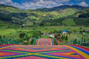 Close view of the rainbow slide at Mongo Land Dalat showing bright colored lanes and textured surface