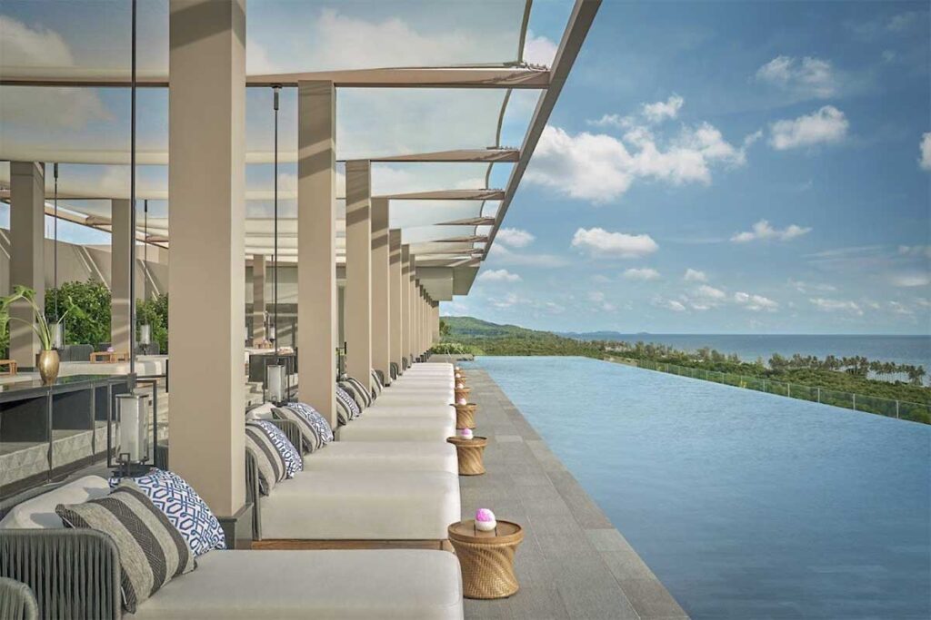 Regent Phu Quoc Long Beach infinity pool with sea view luxury loungers and modern resort design