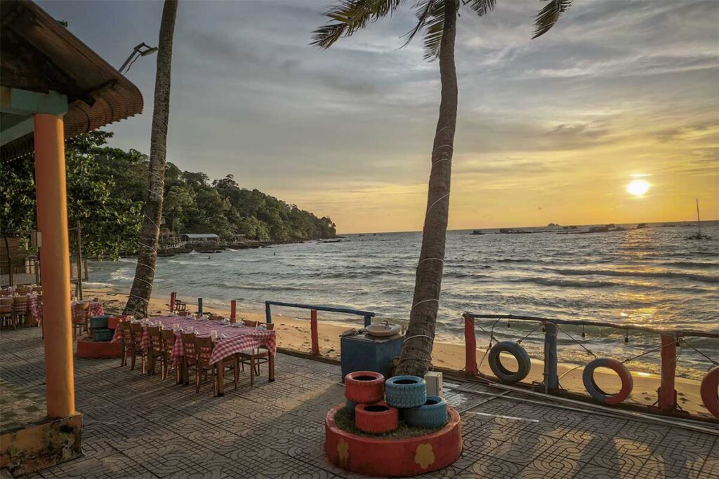 Beachfront restaurant at Ganh Dau Beach Phu Quoc during sunset with sea view dining