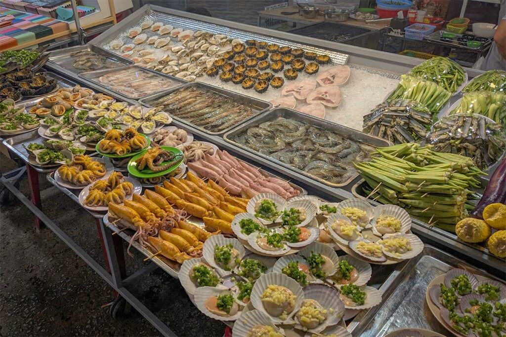 fresh seafood display at Phu Quoc Night Market with squid prawns scallops and shellfish