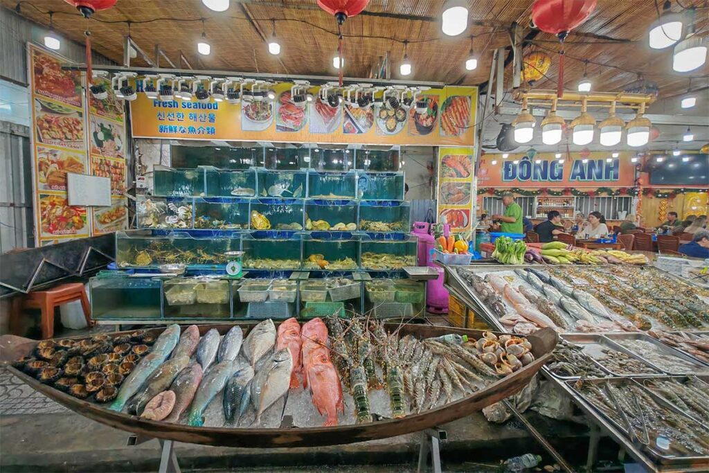seafood restaurant at Phu Quoc Night Market with live tanks fresh fish and lobster display
