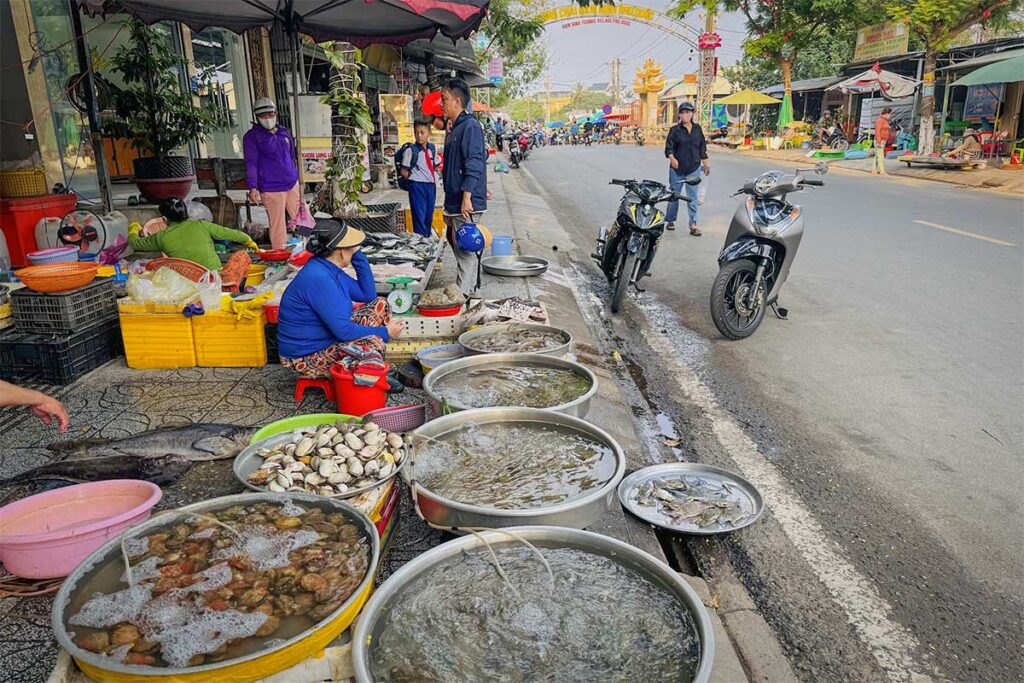 Fresh seafood street market in Ham Ninh fishing village Phu Quoc with live shellfish and local vendors