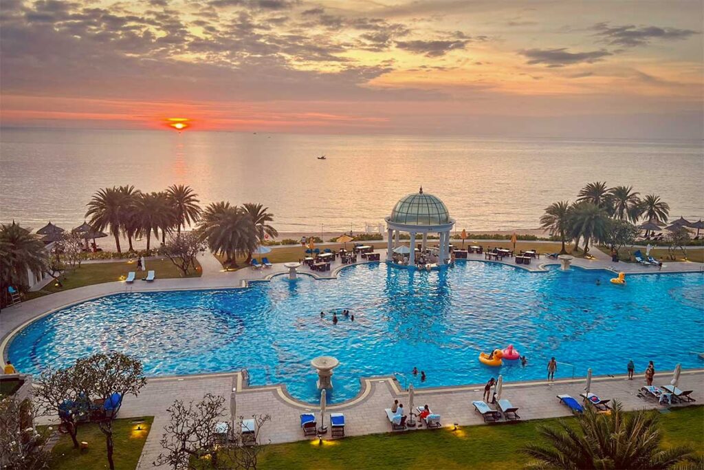 Sheraton Phu Quoc pool overlooking Bai Dai Beach at sunset with sea view and tropical resort setting