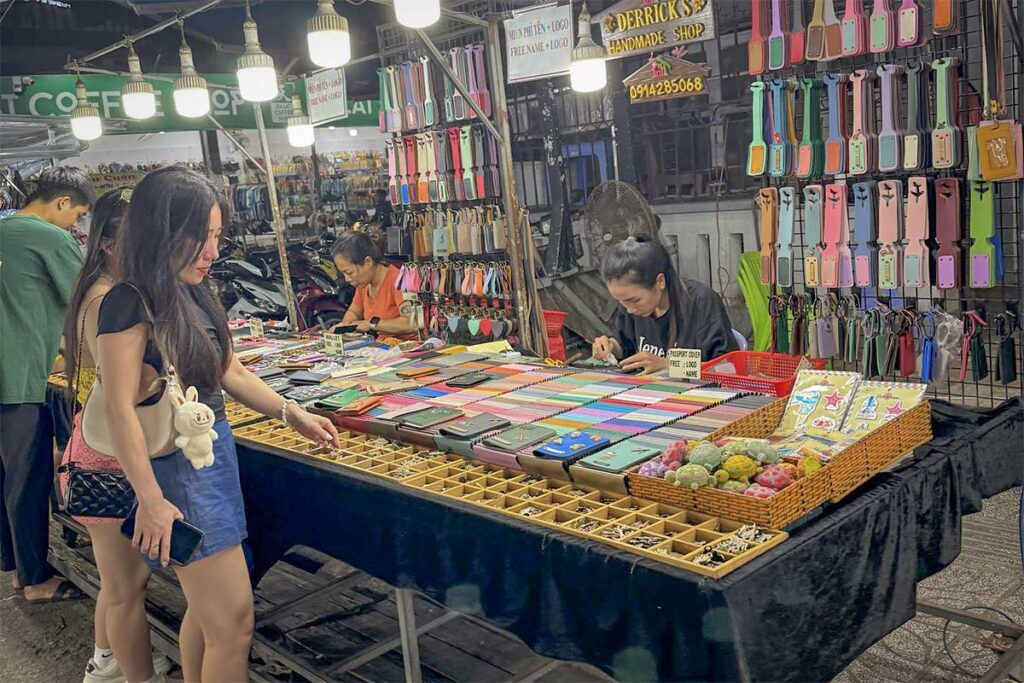 small souvenir stall at Phu Quoc Night Market selling bags phone cases and gifts