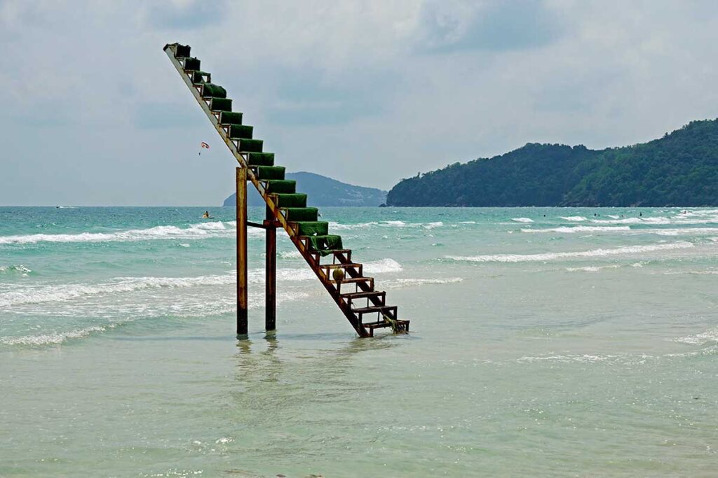 Stairs to heaven photo spot at Bai Sao Beach Phu Quoc standing in shallow turquoise water