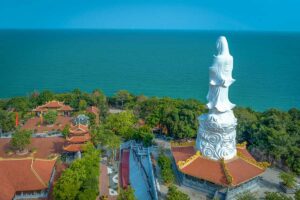 Aerial view of Ho Quoc Pagoda with giant white Buddha statue and ocean views in Phu Quoc