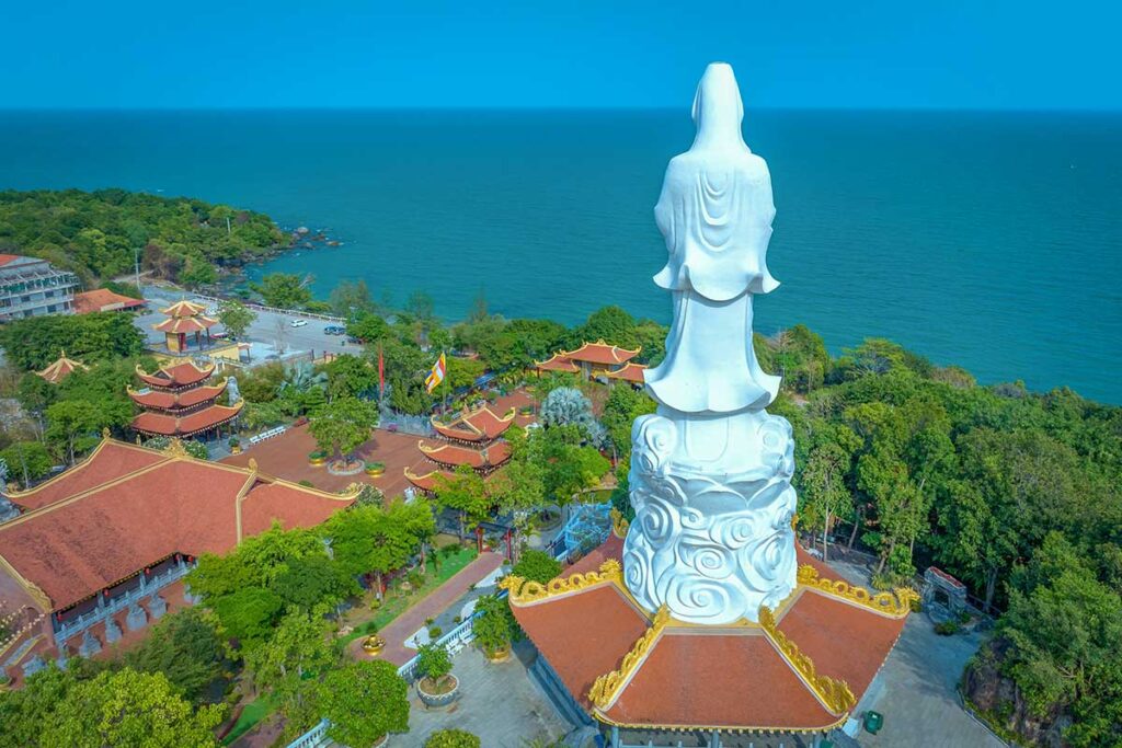 Large white Quan Am statue at Ho Quoc Pagoda overlooking the sea in Phu Quoc Vietnam