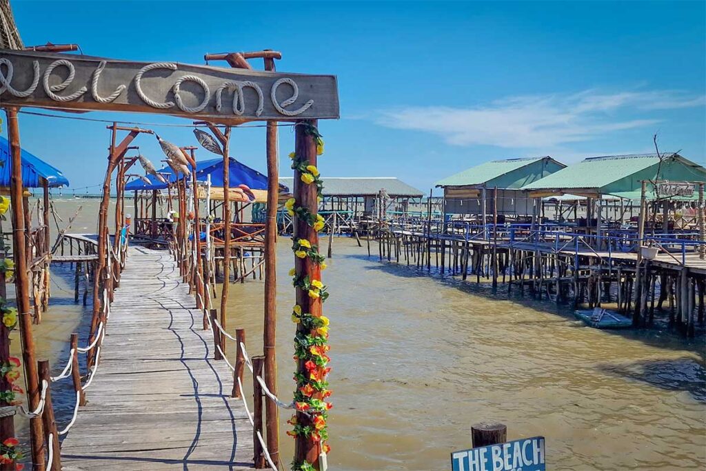 Wooden stilt seafood restaurants in Ham Ninh fishing village Phu Quoc built above the shallow sea