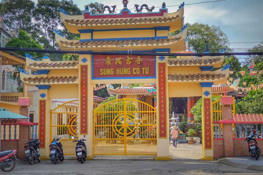 Entrance gate of Sung Hung Pagoda in Duong Dong Phu Quoc with traditional temple architecture and yellow walls
