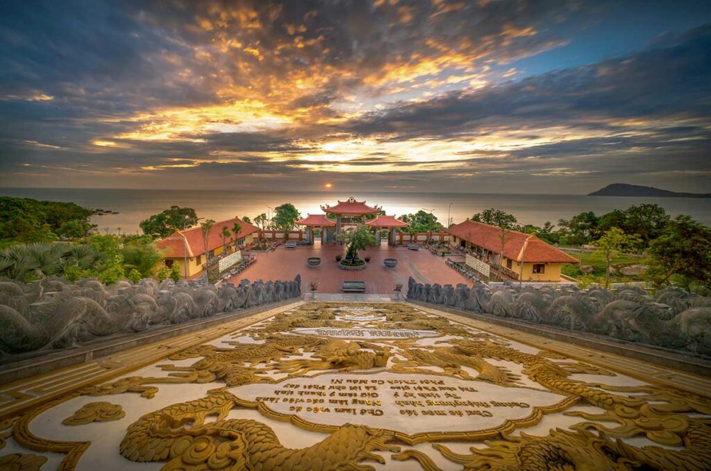 Sunrise view from dragon staircase at Ho Quoc Pagoda overlooking the sea in Phu Quoc