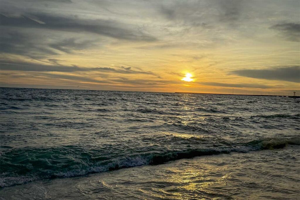 Sunrise over the sea at Ham Ninh fishing village Phu Quoc with waves along the shoreline