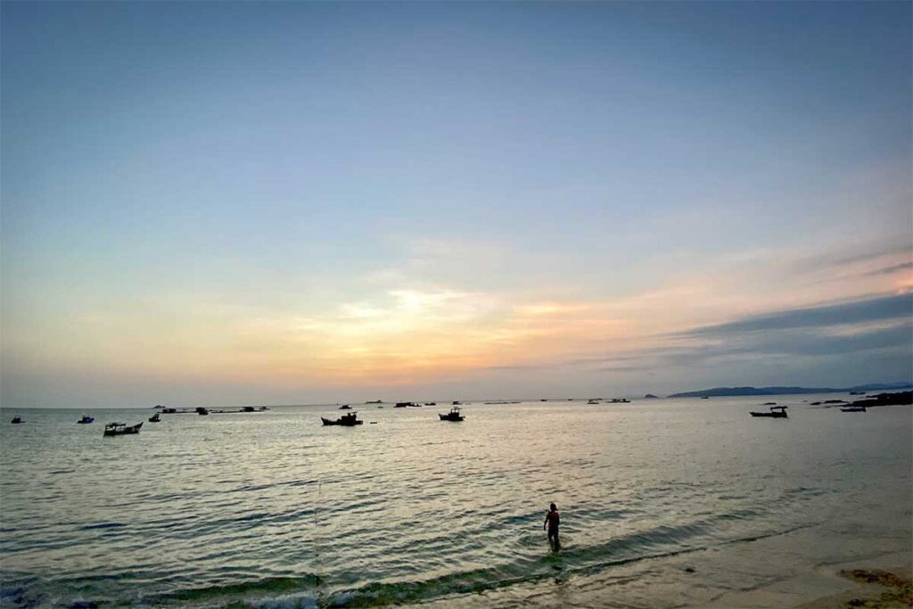 Sunset at Ganh Dau Beach Phu Quoc with fishing boats and peaceful shoreline