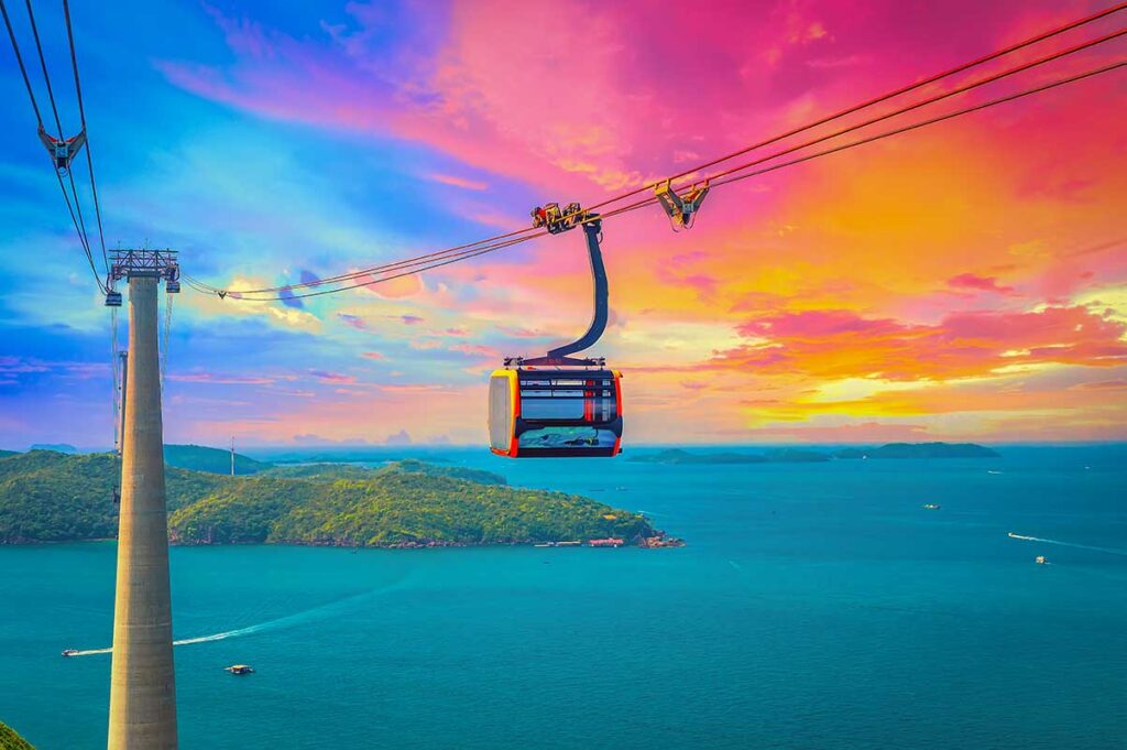 Phu Quoc Cable Car cabin above sea and islands during colorful sunset sky