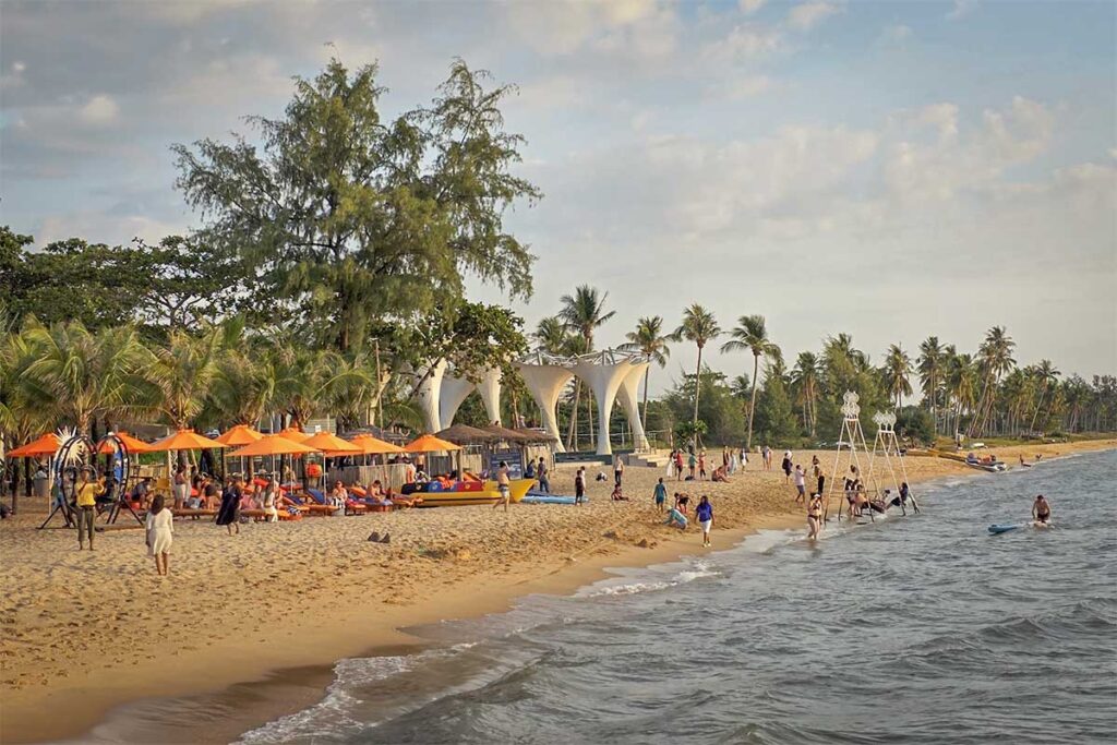 Long Beach Phu Quoc lively beach area with swimming people beach clubs and tropical shoreline