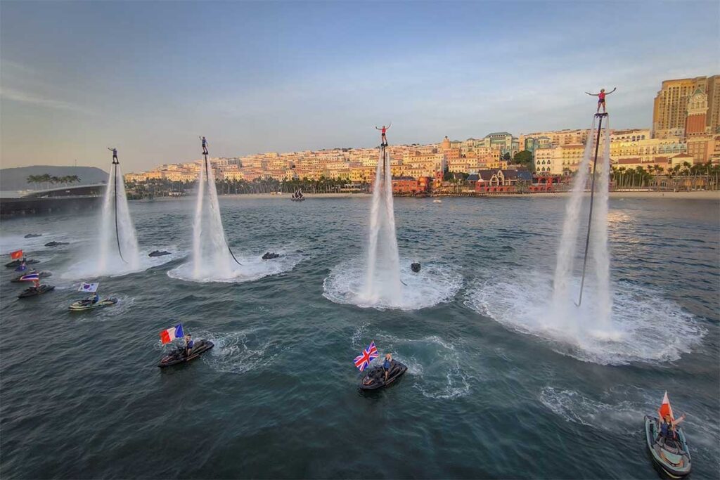 Symphony of the Sea show in Sunset Town Phu Quoc with flyboard performers jetski stunts and water spray effects on the sea