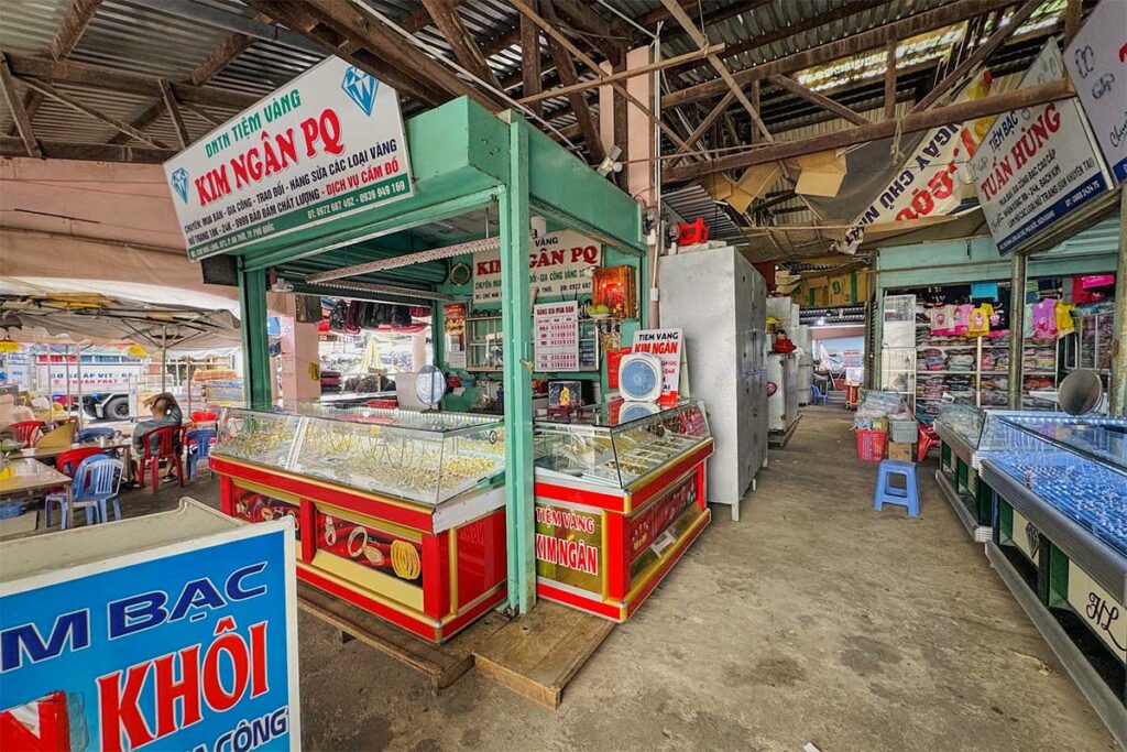 Jewelry and gold shops inside An Thoi Market in Phu Quoc with small local stalls and traditional indoor market atmosphere