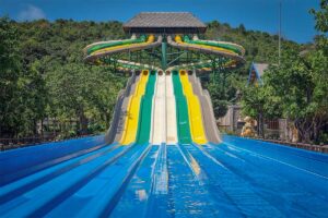 Aquatopia Water Park Phu Quoc multi lane water slides with colorful tracks and splash pool at bottom