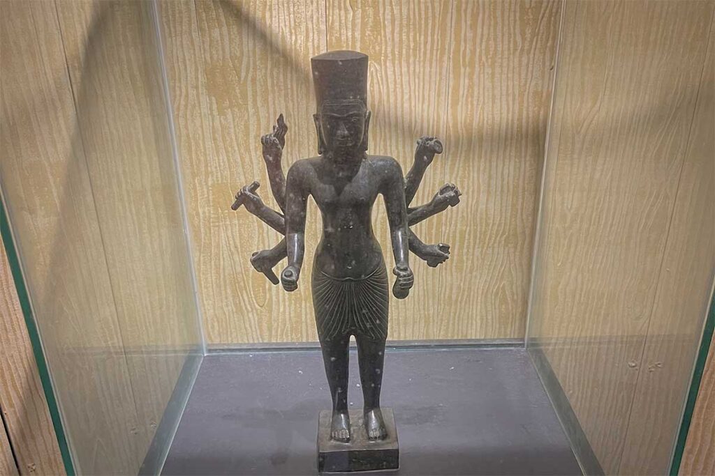 Ancient Champa multi-armed bronze deity statue on display in the Champa heritage room at Lang Chai Xua Fish Sauce Museum in Phan Thiet