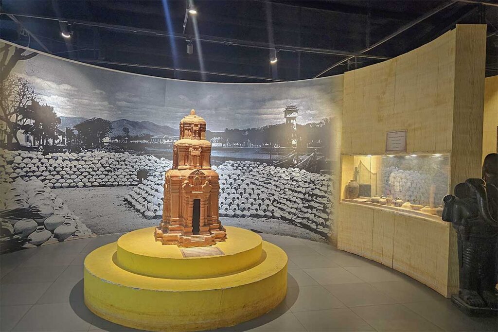 Champa heritage room at Lang Chai Xua Fish Sauce Museum featuring a scale model of the Po Sah Inu Cham towers and a historical panoramic backdrop of Phan Thiet