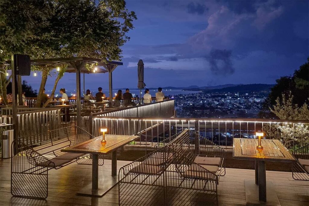 Night view from Chuon Chuon Bistro and Sky Bar in Phu Quoc with hilltop seating, city lights, and panoramic views over Duong Dong