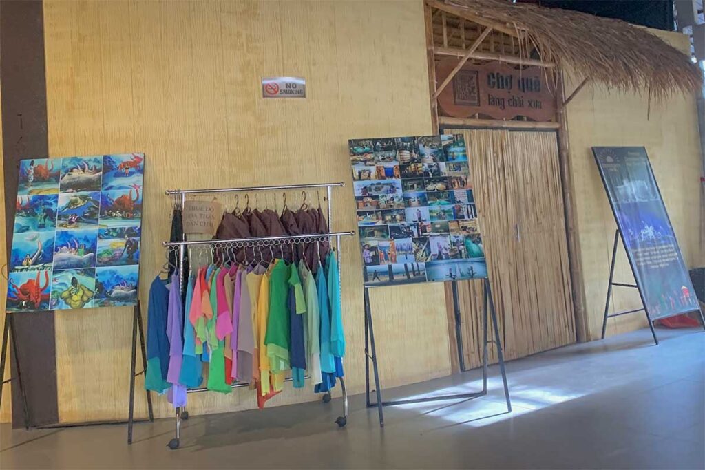 Costume rental area at Lang Chai Xua Fish Sauce Museum in Phan Thiet with traditional fisherman and salt farmer outfits available for visitors