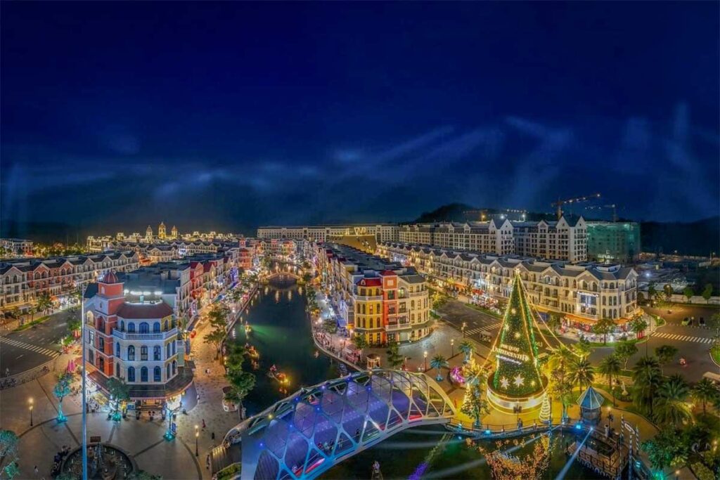 Night view of Grand World Phu Quoc with illuminated Venice River canal colorful buildings and lighted bridge
