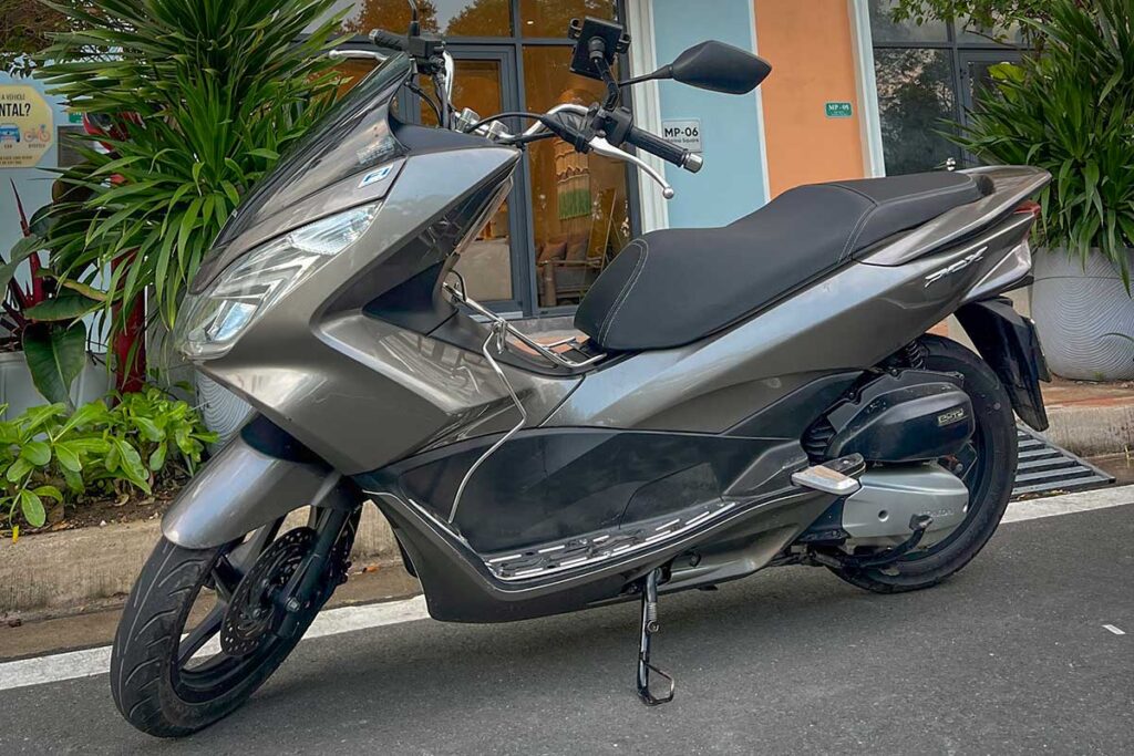 Honda PCX 150 automatic scooter for rent in Phu Quoc, parked on Long Beach road in Duong Dong