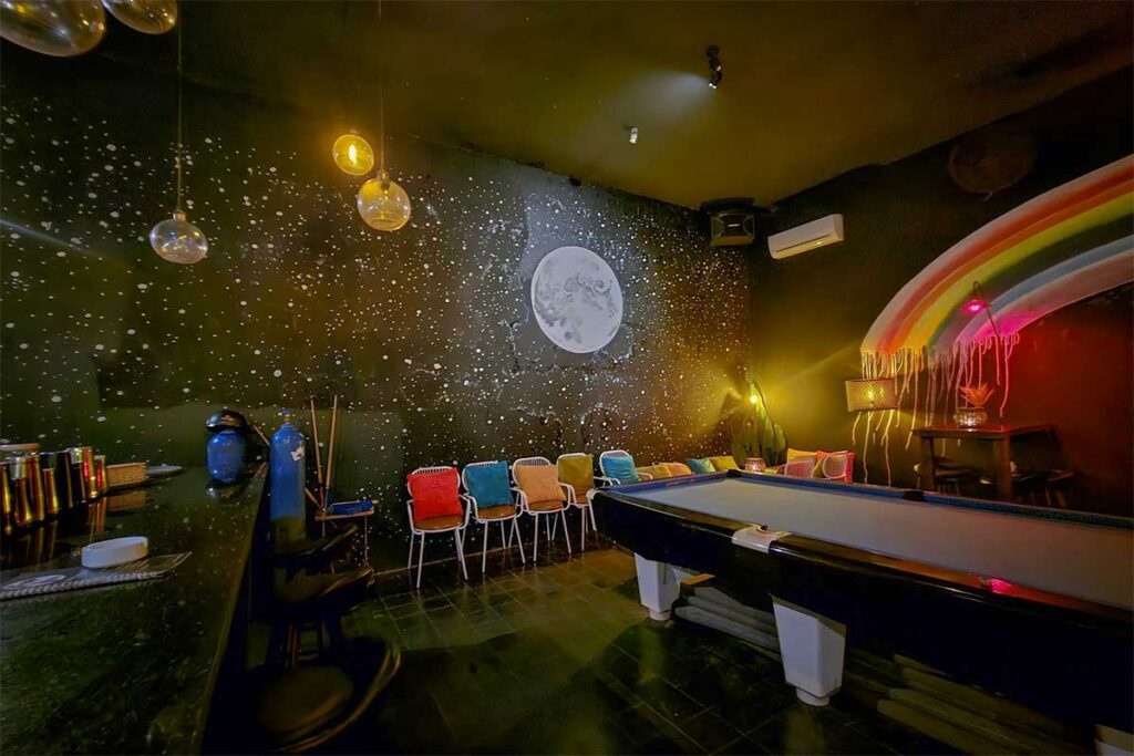 Modern nightlife lounge in Phu Quoc with pool table, colorful lighting, and relaxed indoor bar atmosphere for evening drinks