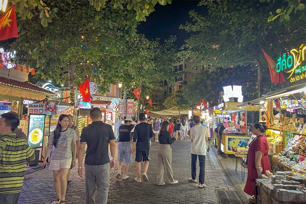 Vui Fest Bazaar night market in Sunset Town Phu Quoc with street food stalls lights and busy evening crowd