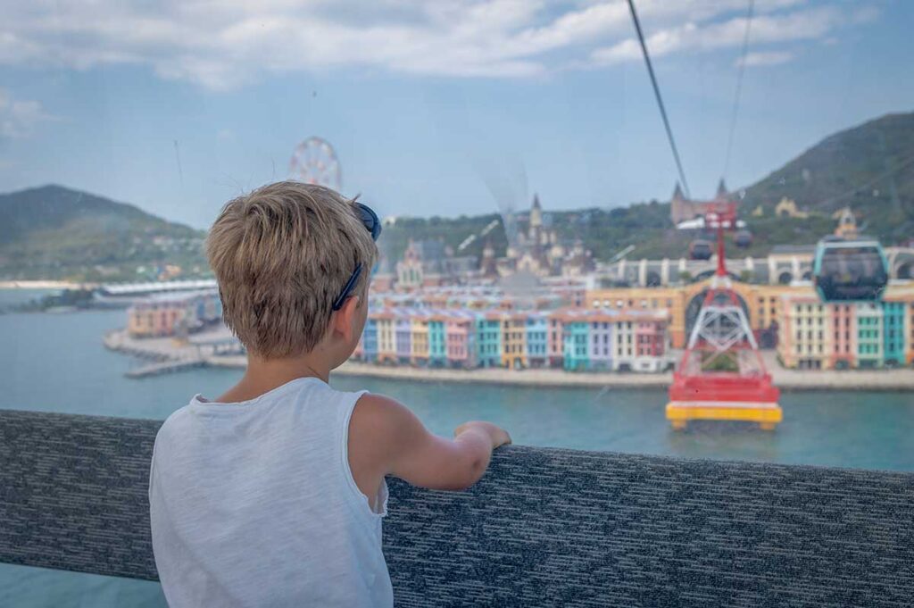 Child enjoying the Phu Quoc Cable Car ride above Sunset Town and Hon Thom Island