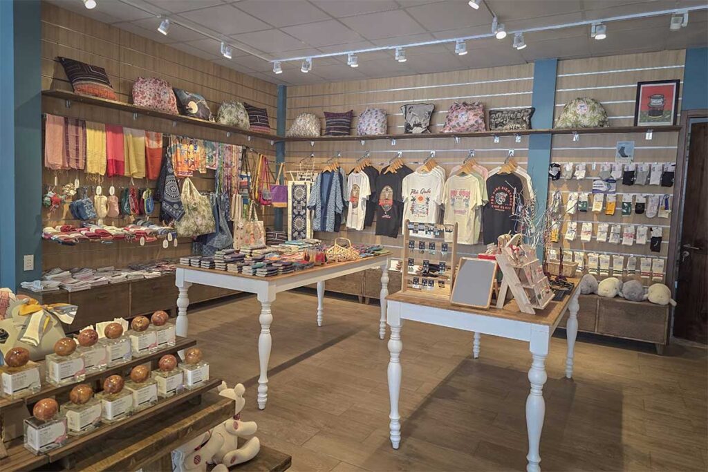 Modern souvenir shop in Phu Quoc with local clothing handmade bags scarves and island themed gifts displayed inside a tourist store