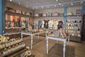 Modern souvenir shop in Phu Quoc with local clothing handmade bags scarves and island themed gifts displayed inside a tourist store