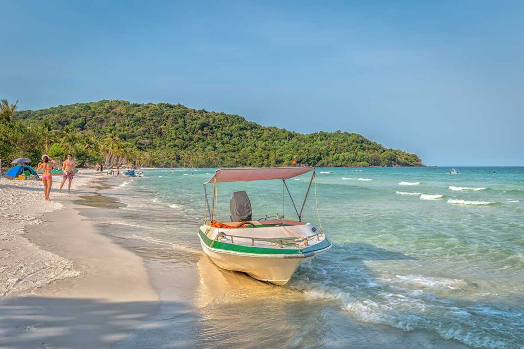 Private speedboat parked on a sandy beach during a Phu Quoc island hopping and beach tour