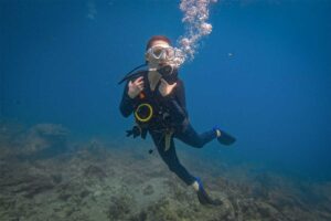 scuba diver exploring shallow reef during diving in Phu Quoc Vietnam