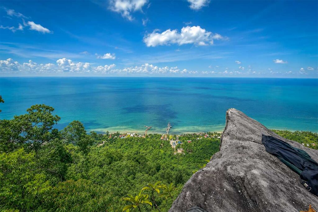Panoramic view from the top of Da Bac Mountain in Phu Quoc, looking out over the turquoise sea and Ham Ninh fishing village below