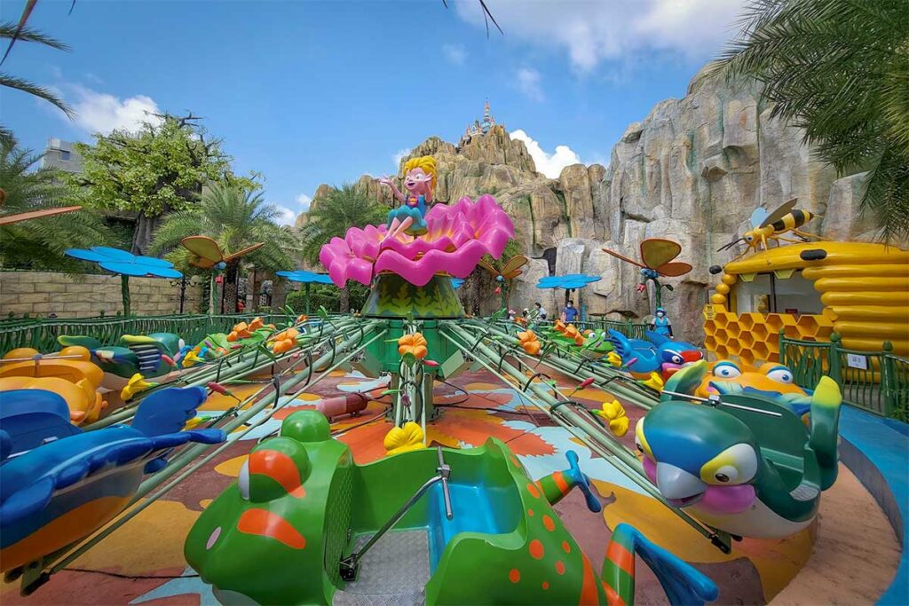 Colorful family ride inside VinWonders Phu Quoc with cartoon themed flying attractions and fantasy style decorations