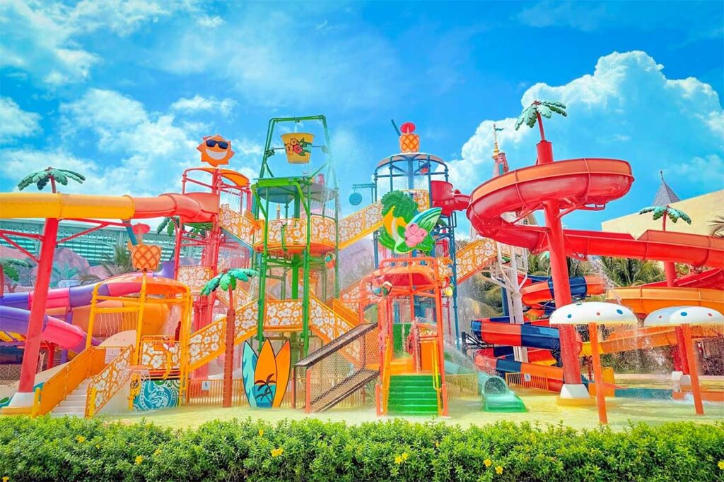 Colorful water slides and splash playground at Typhoon World water park in VinWonders Phu Quoc under a sunny blue sky