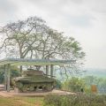 A1 Hill tours with the preserved French tank memorial overlooking the valley in Dien Bien Phu