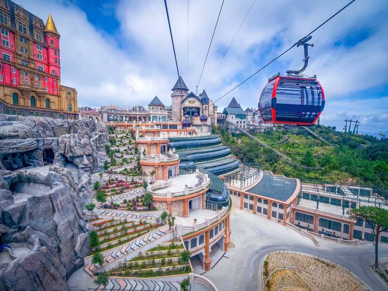 Ba Na Hills cable car arriving at the peak with the castle and French village